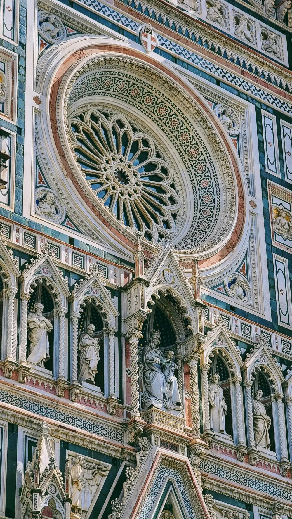 Cathedral rose window and carved saints